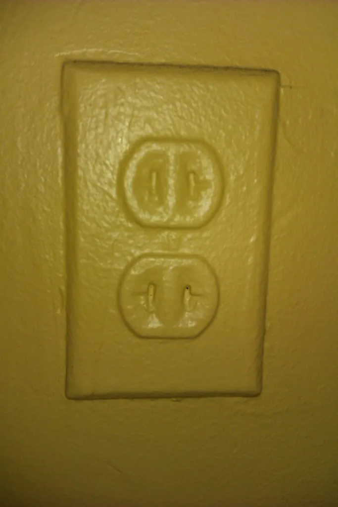 real life application of protecting groups is painters tape for example look at this power outlet that has been painted over fail